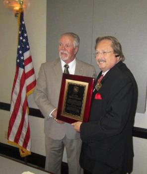 Executive Director J.D. Hobbie was presented with a plaque recognizing  his hard work lobbying with the Alabama Legislature.